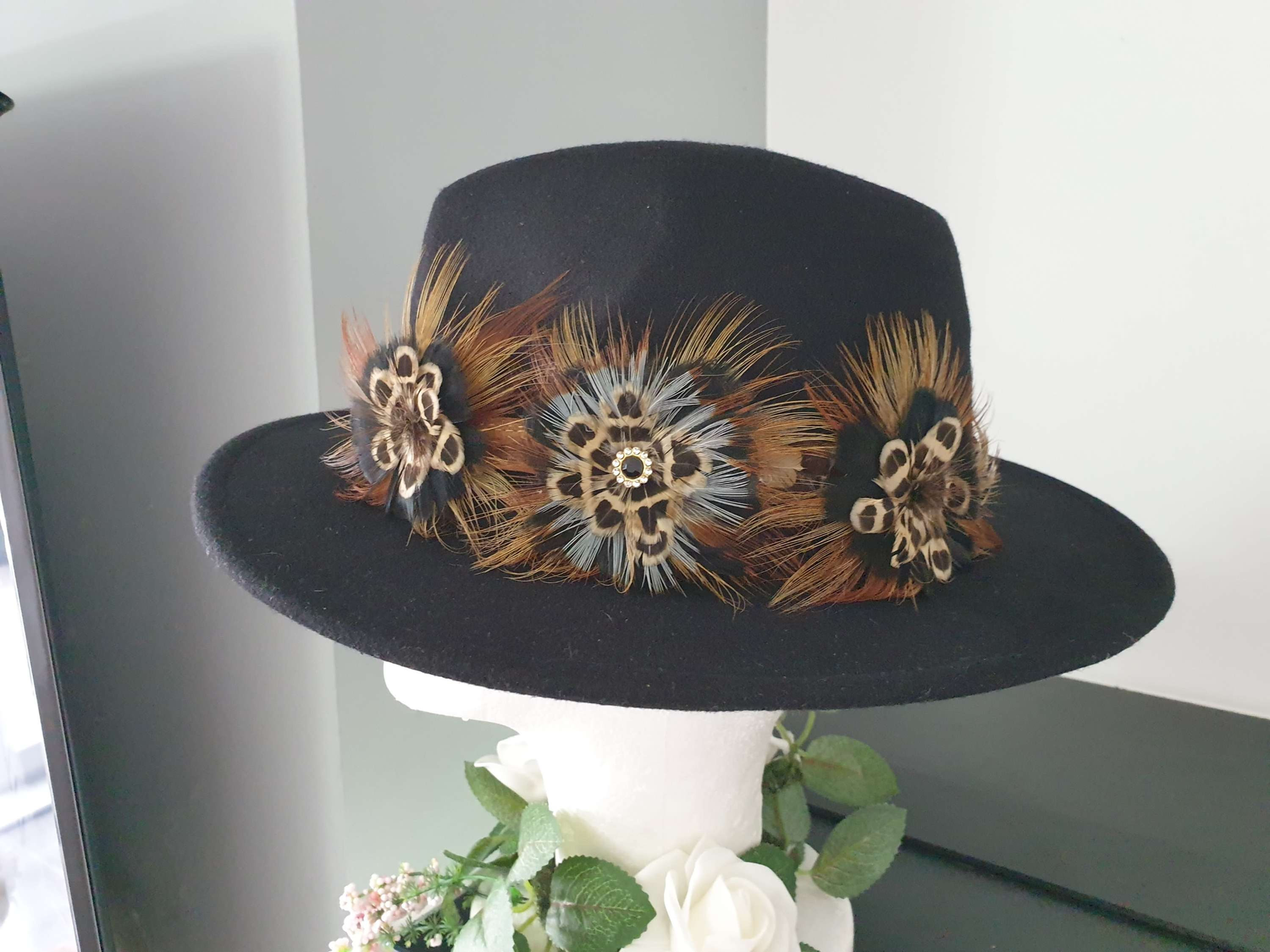 Black fedora with this beautiful 3 flower feather brooch