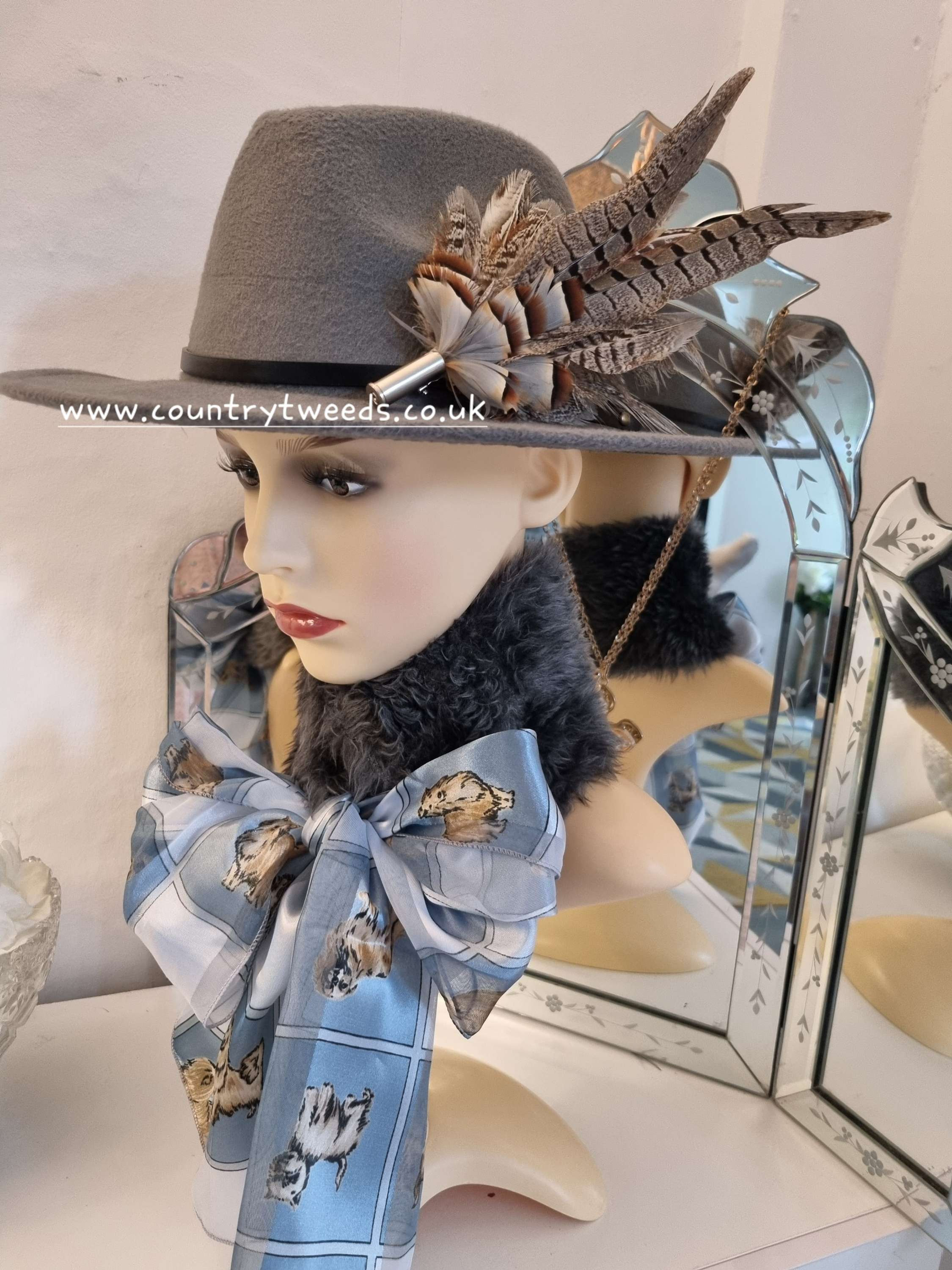 Grey fedora with matching grey pheasant feather pin