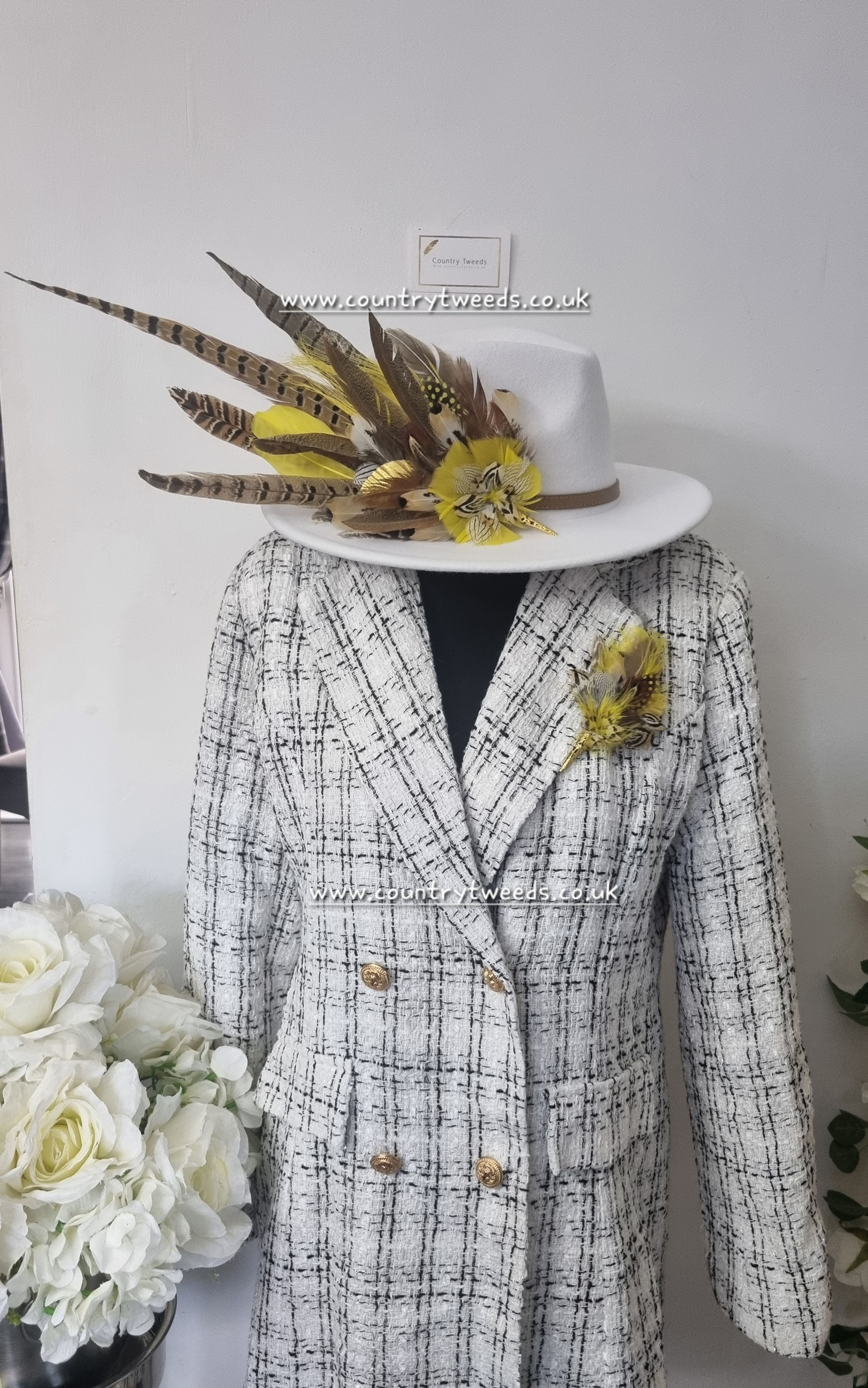 White fedora hat with lemon feather design &matching jacket brooch