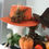 Thumbnail: Orange fedora hat with a autumn 🍂 design feather brooch 