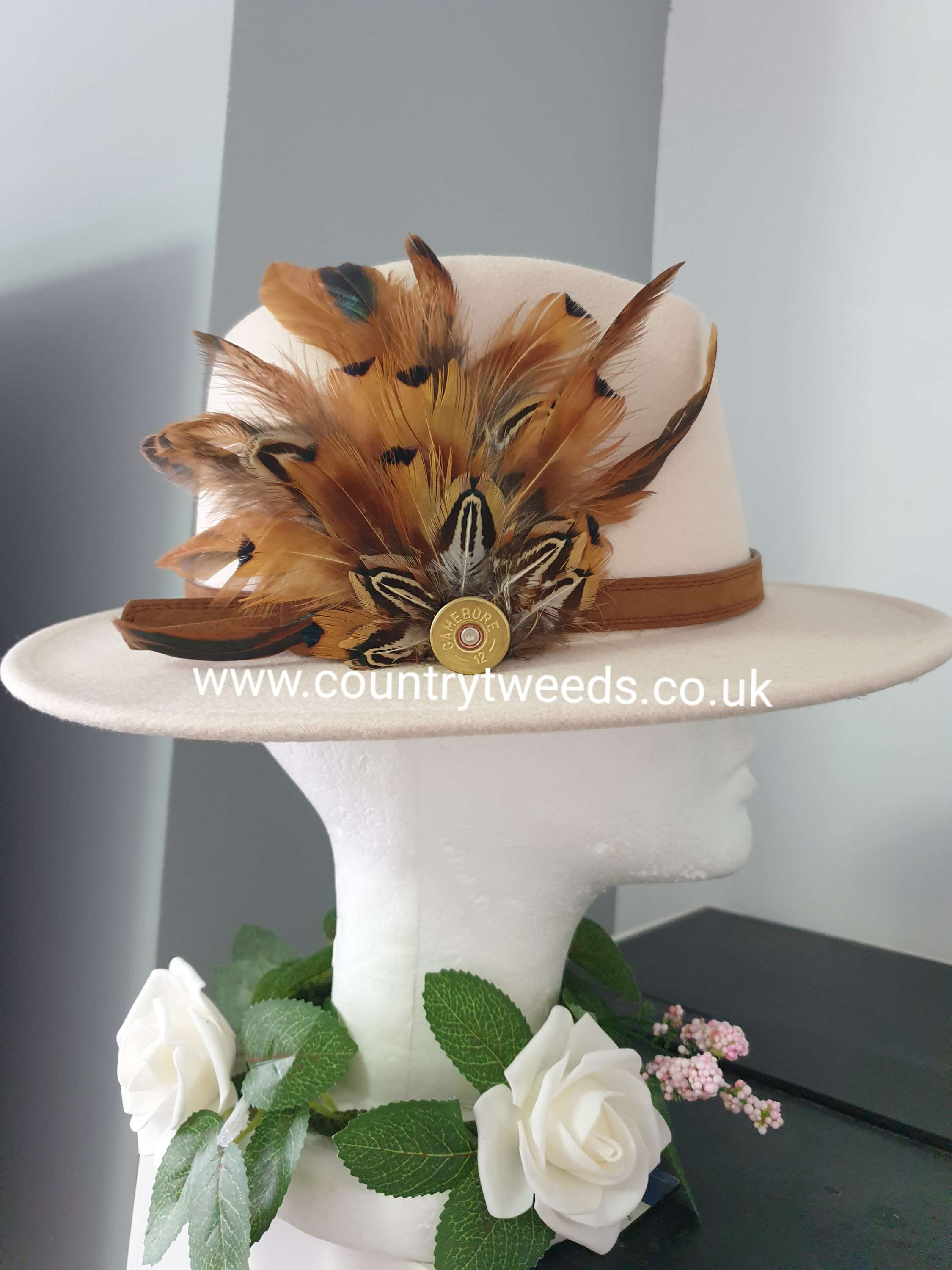 Cream fedora hat with this beautiful feather brooch