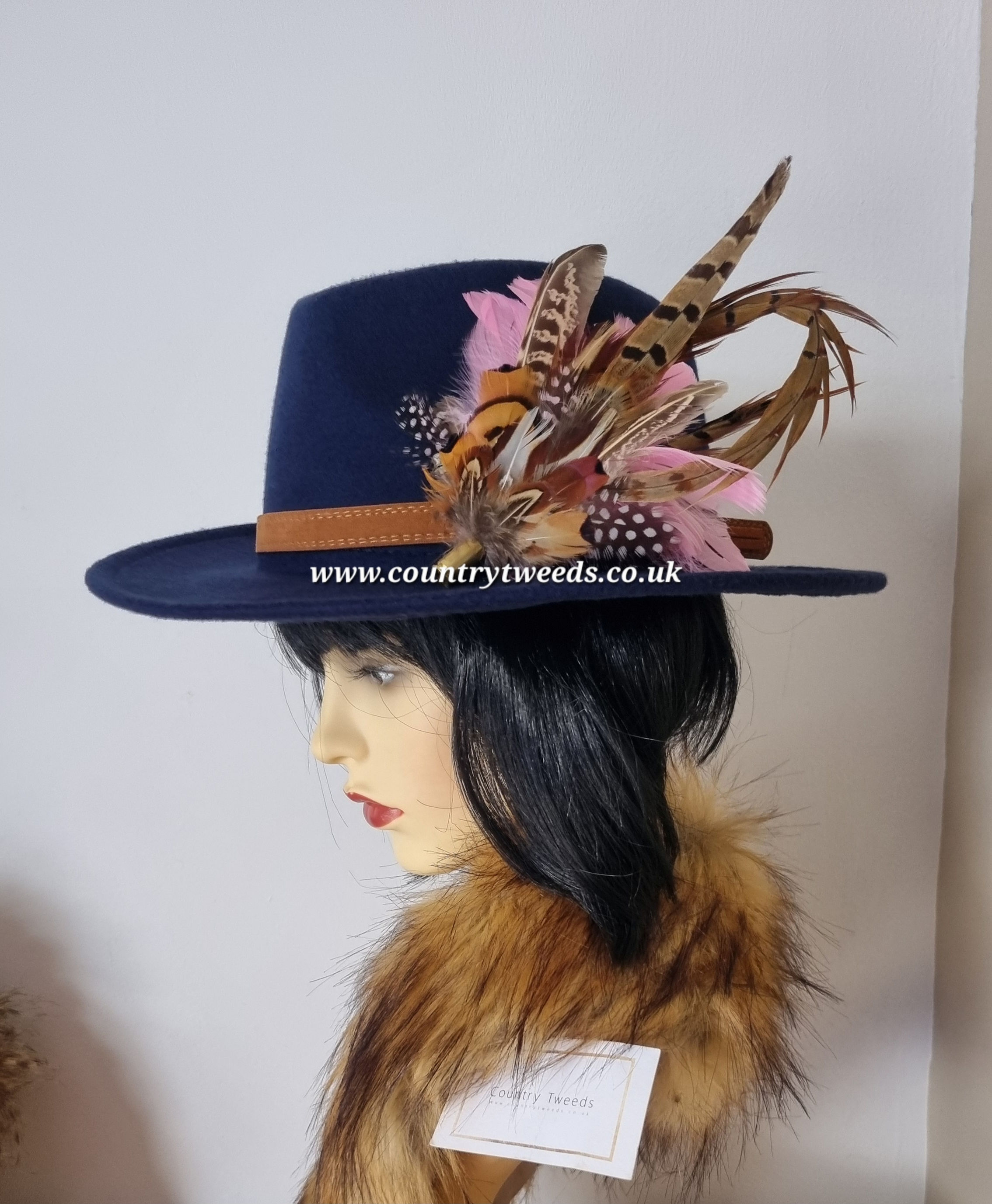Navy blue fedora hat comes with this beautiful detachable feather brooch