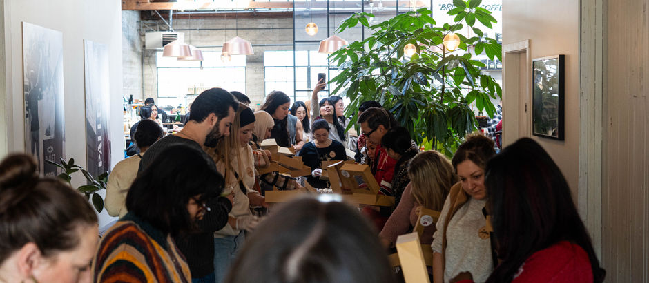 A group of people gathering together for a cookie swap event in Vancouver