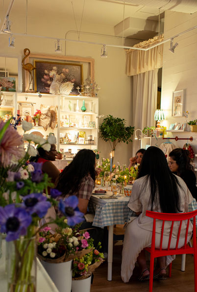 A group of people enjoying food for a cookbook club event in Vancouver