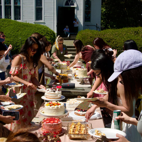 A group of people from Vancouver Cookbook Club gathering for a Cake Garden Picnic