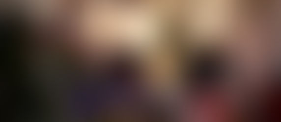 A group of people gathering together for a cookbook club inside a floral shop