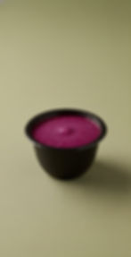 Bowl of vibrant Pear and Beet Textured Mash on a light green surface.
