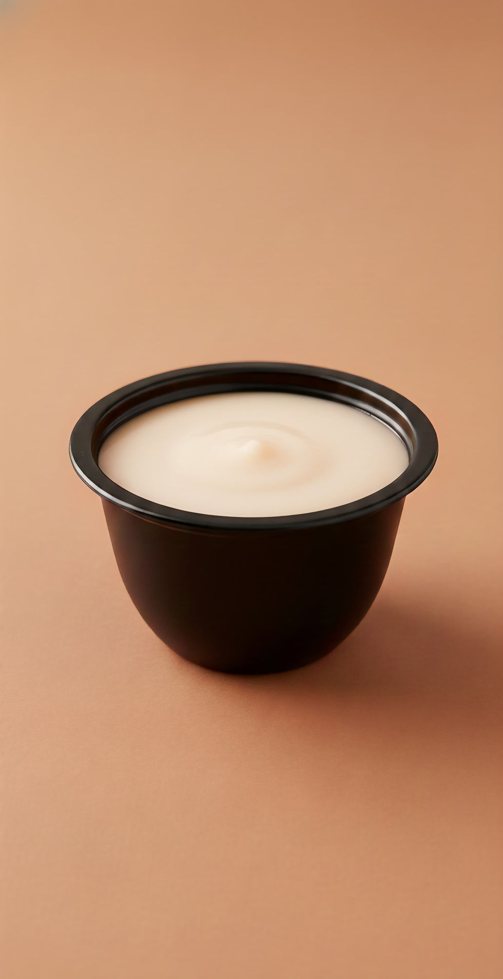 Bowl of Apple Oatmeal Puree on a brown surface, ready to eat.