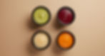 Four bowls of puree, various colors, on a tan background, 7 Purees of the Week.