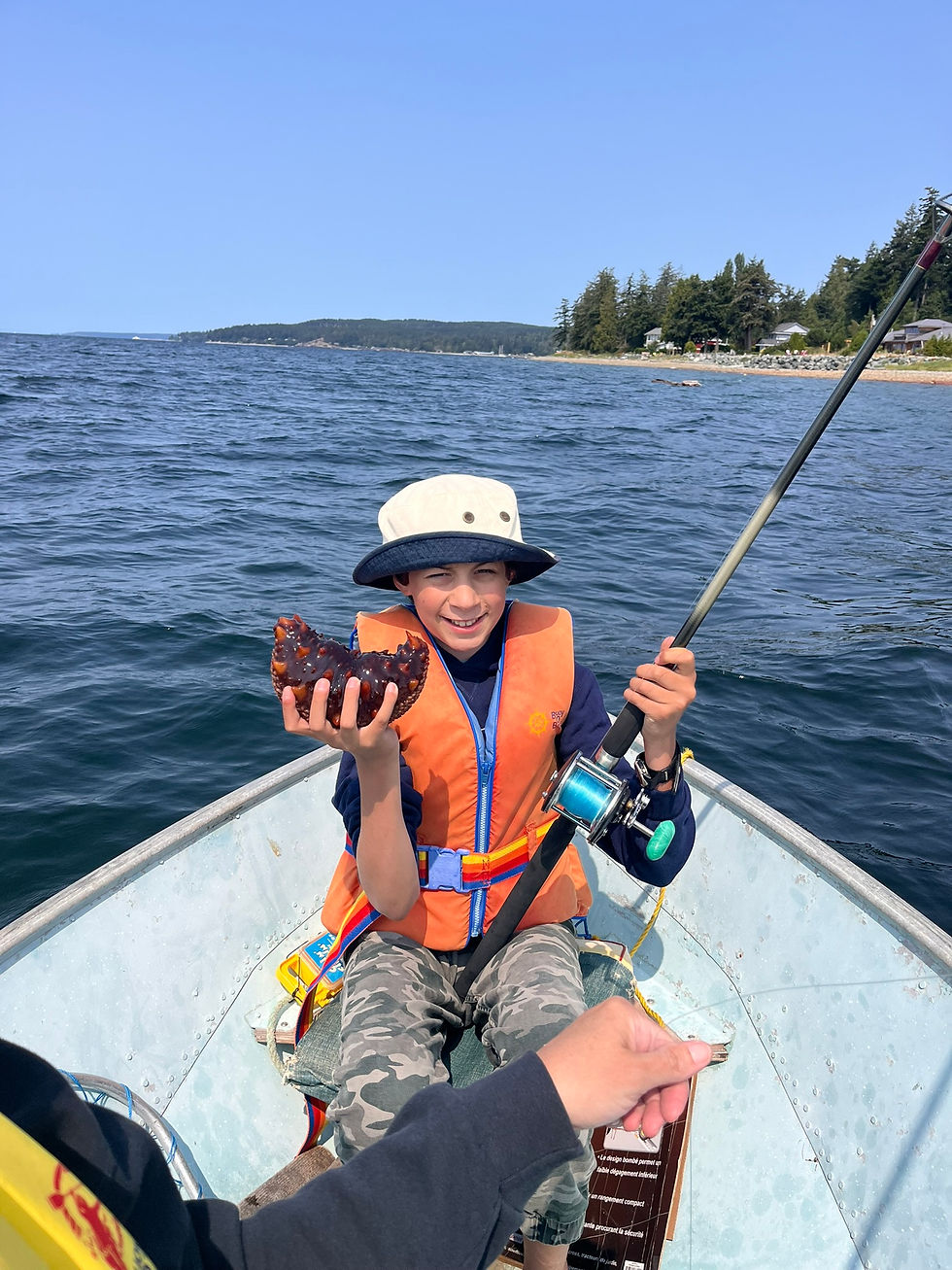 Jakaya fishing in a small boat