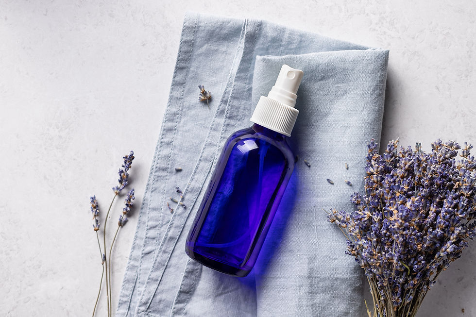 blue essential oil spray bottle with lavender