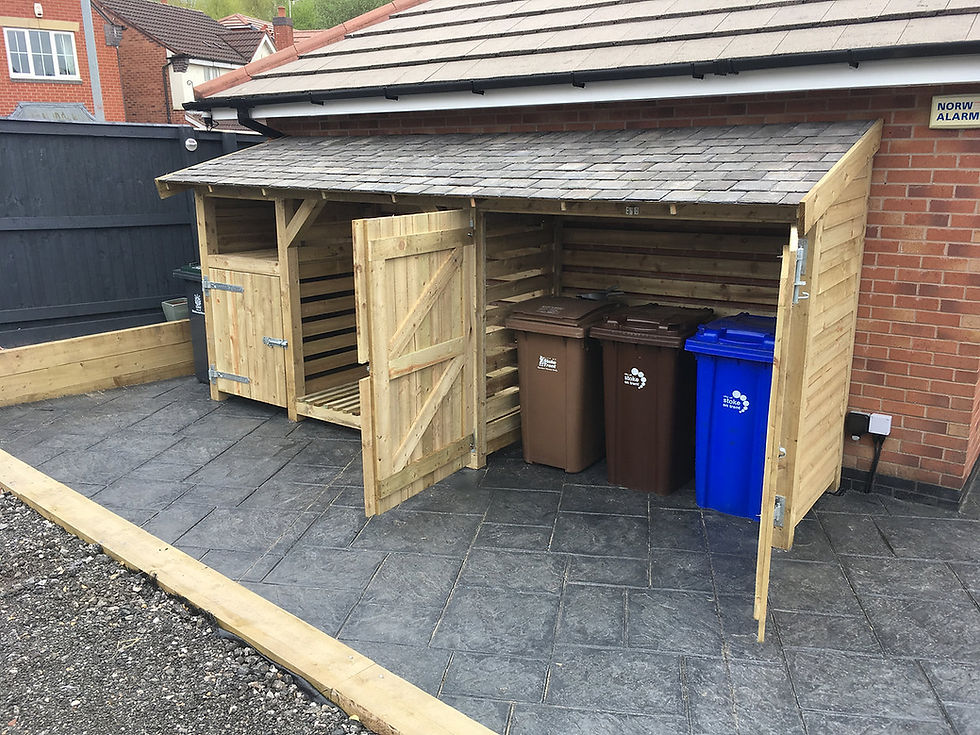 Thumbnail: Large Log Store filled with logs with doors either side for bin store areas