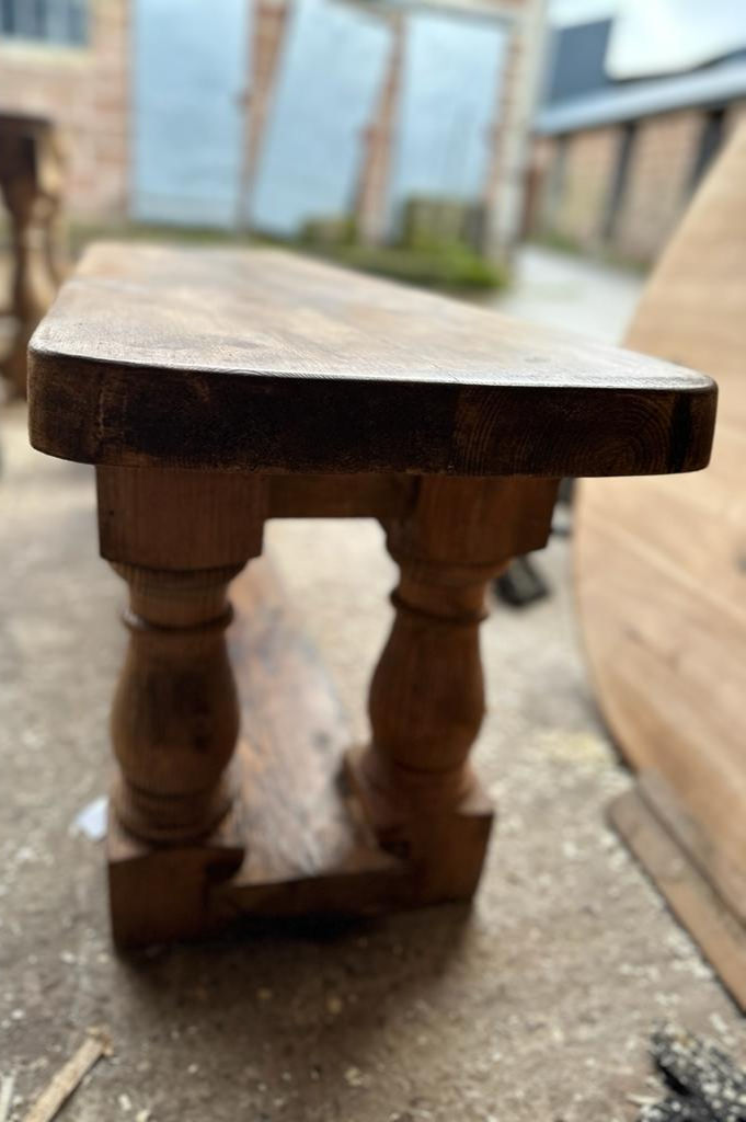 Thumbnail: Handmade in Devon a reclaimed pine bench seat with turned legs just made outside of workshop end view