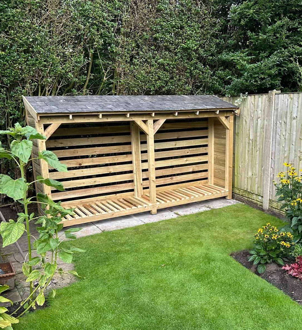 Handmade in the UK, Dave Log Store with a reclaimed slate roof located in a garden