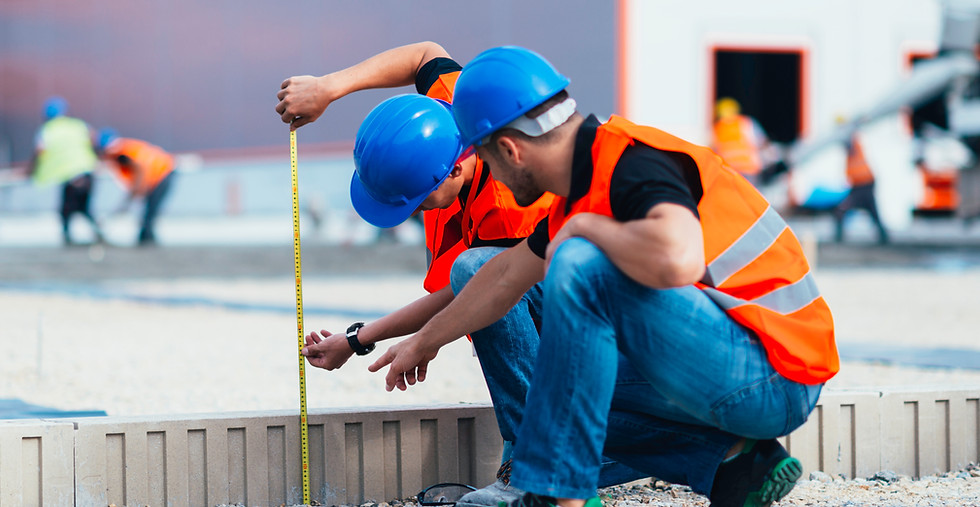 Construction Workers Measuring