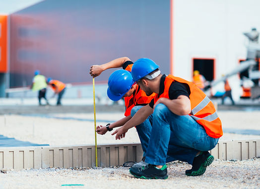 Construction Workers Measuring