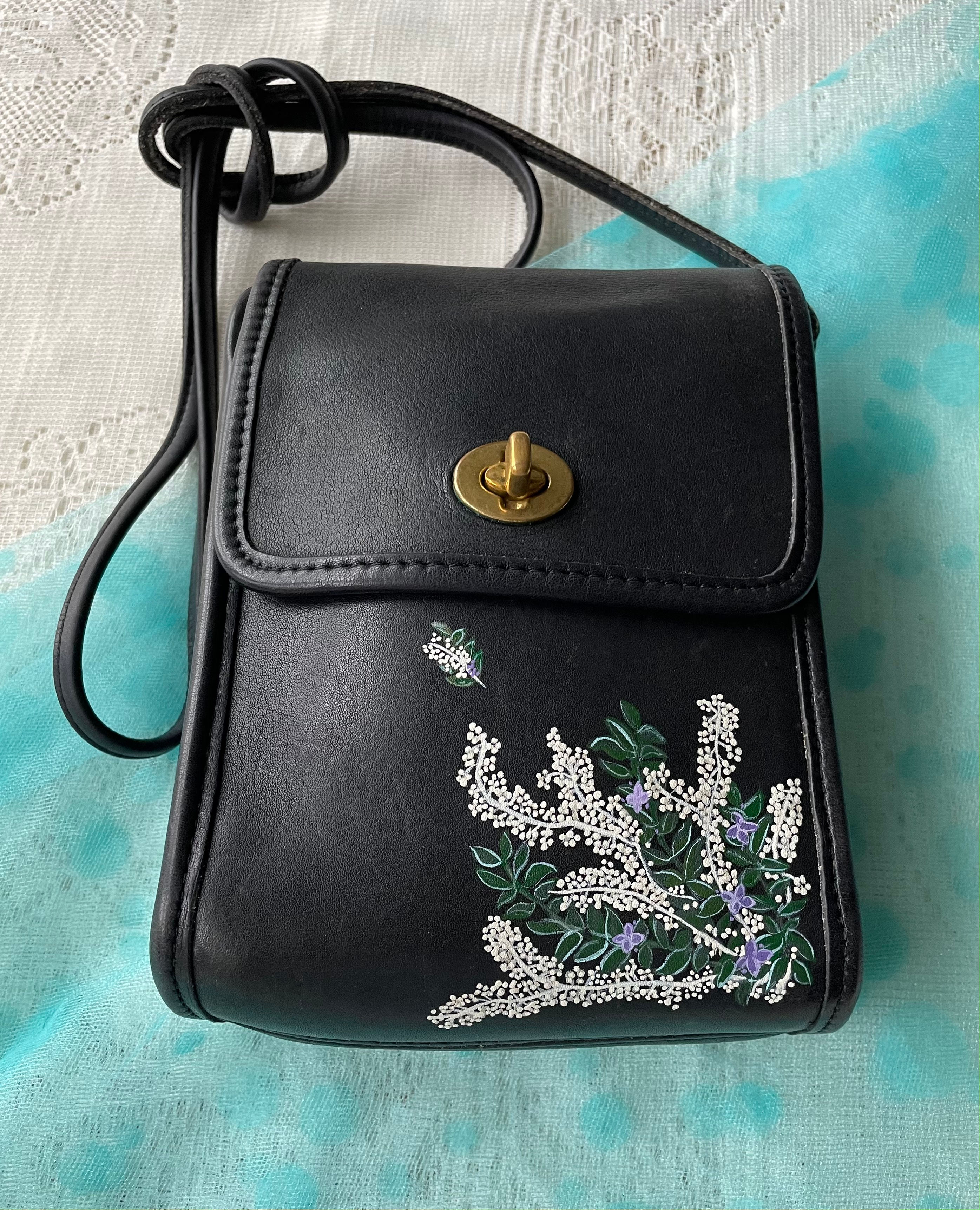 Black leather shoulder bag with embroidered floral design sixteensisters.com