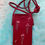 Thumbnail: Burgundy crossbody bag with white floral design. sixteensisters.com