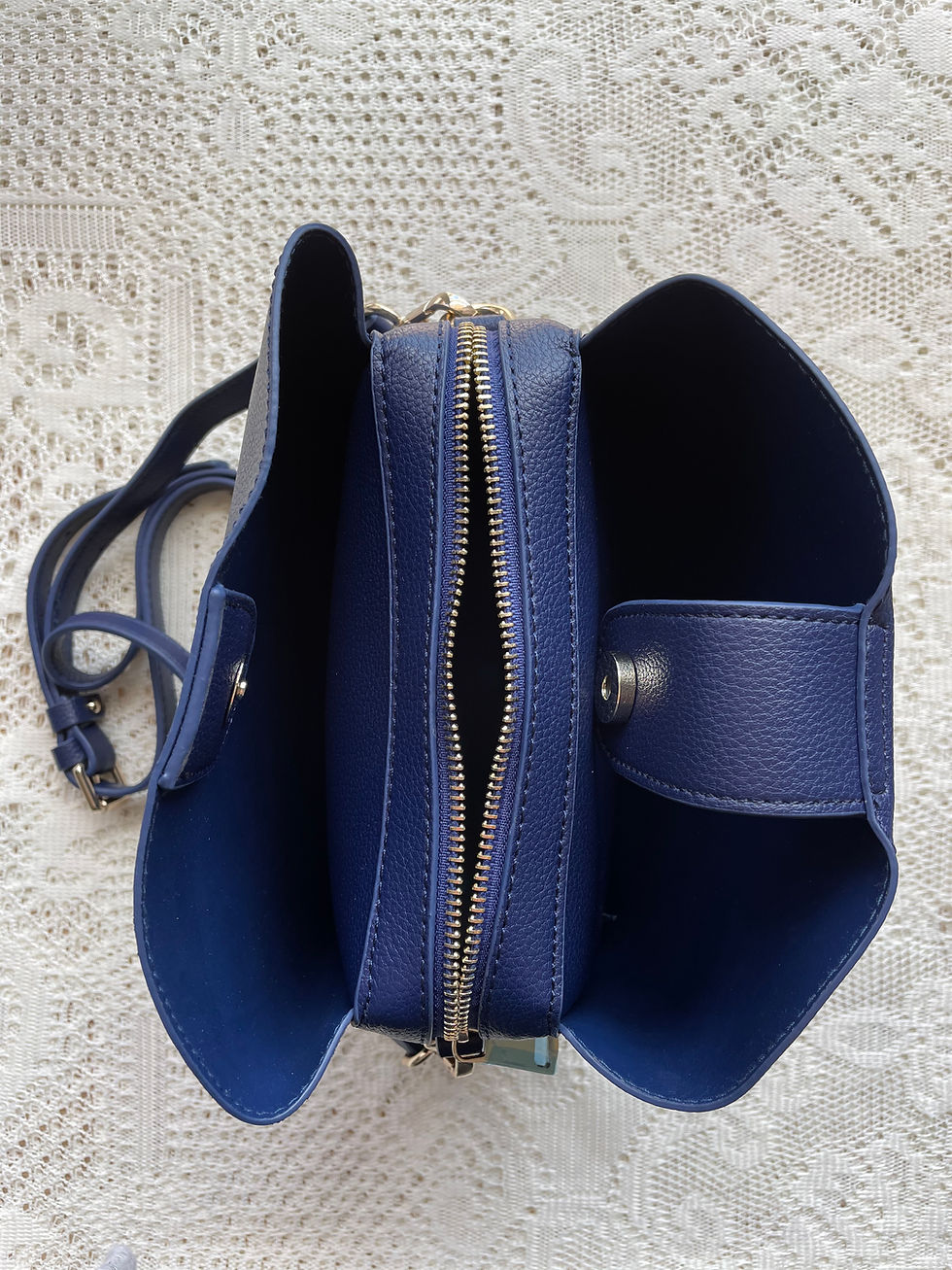 Thumbnail: Open blue handbag revealing interior compartments, DANA ~ Vintage Woven Handbag, sitting on white lace.