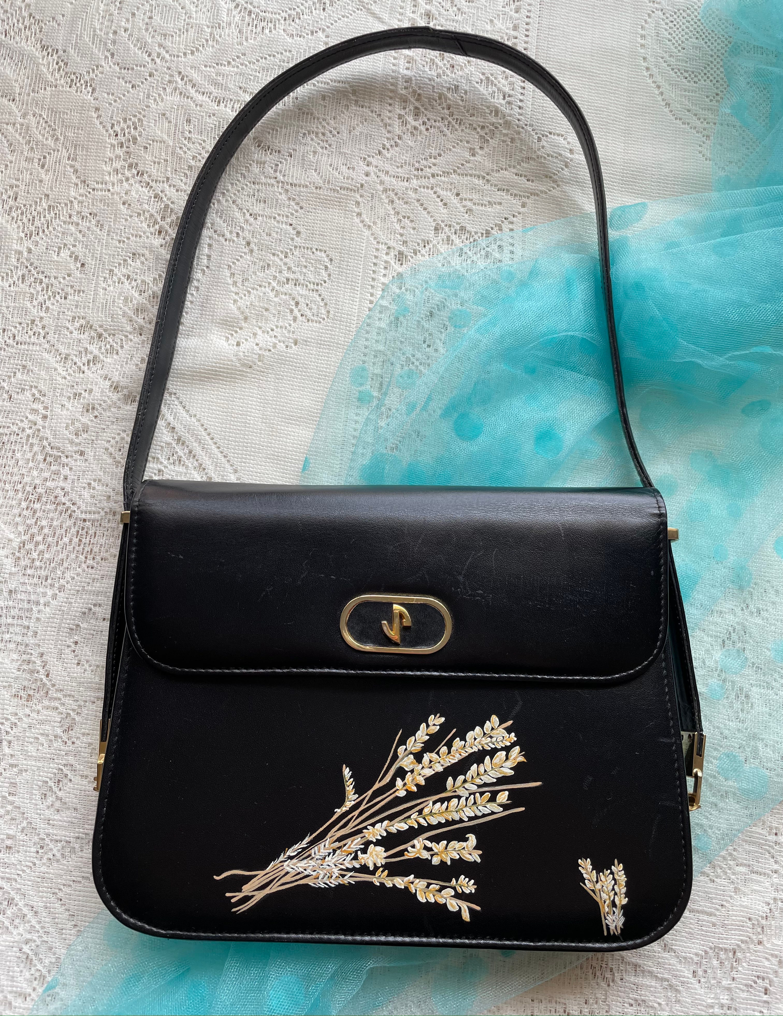 Black handbag with floral design, DANA ~ Vintage Woven Handbag, elegant and stylish.