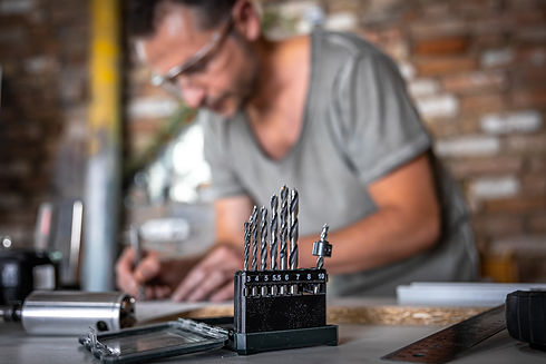 close-up-set-wood-drills-work-table-joiner-workshop.jpg