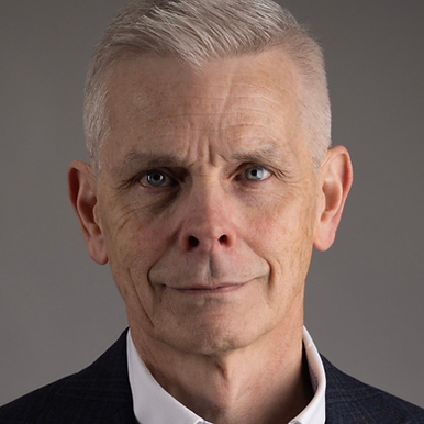Portrait of a male Board of Directors member with gray hair smiling