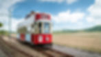 Seaton Tramway Tram 12, A red tram carries smiling passengers along the estuary