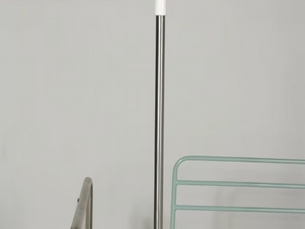 Stainless steel IV stand with 4 hooks and mobile fibre base for emergency hospital use.