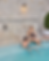 couple drinking champagne in the outdoor hot spa pool at spa mirbeau rhinebeck