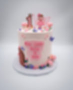 Pink fairy garden 1st birthday cake with a fondant toadstool door, butterflies and sugar flowers
