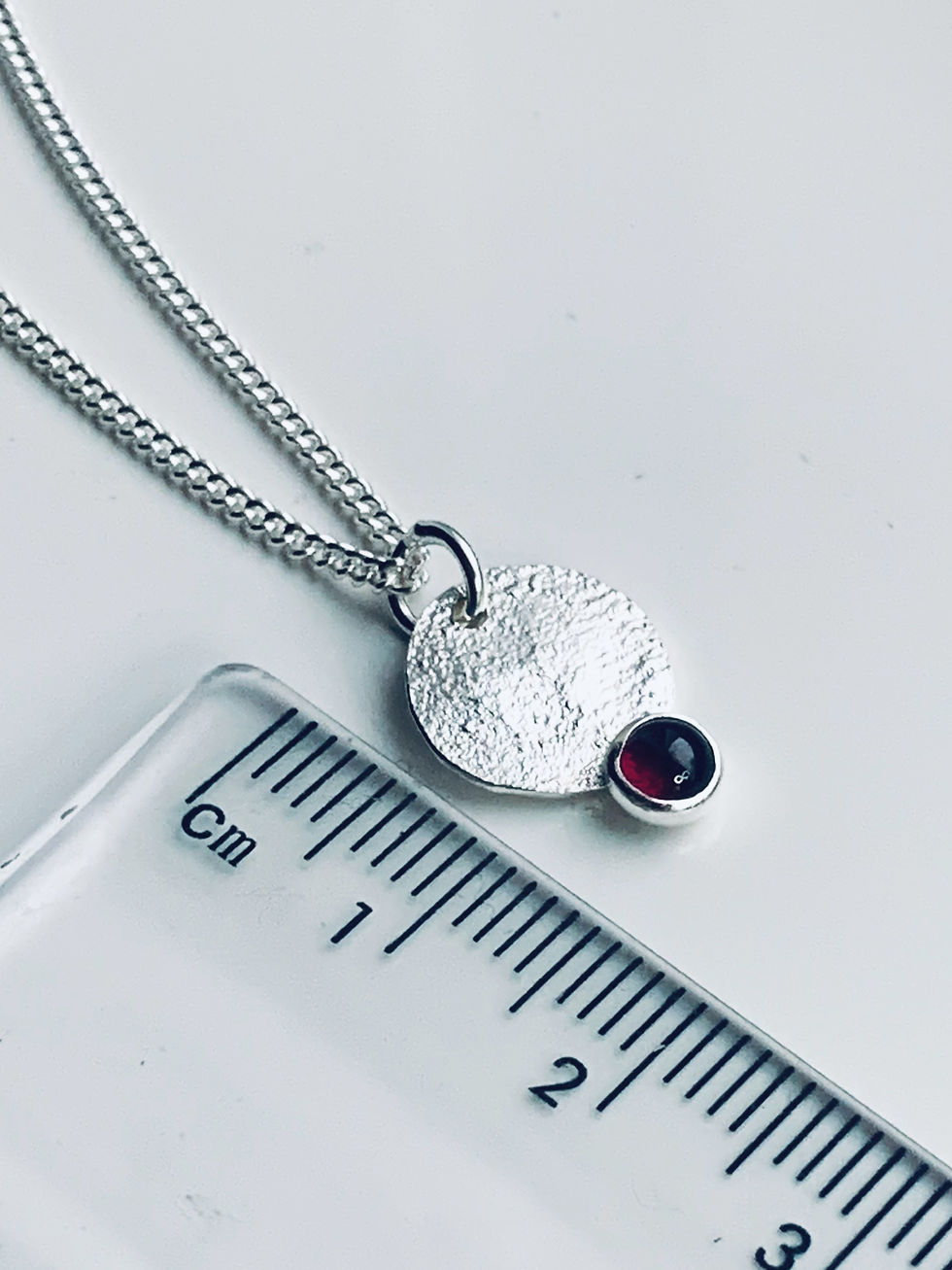 Thumbnail: Recycled Sterling Silver Garnet Pendant by Nyaki Punk Jewellery