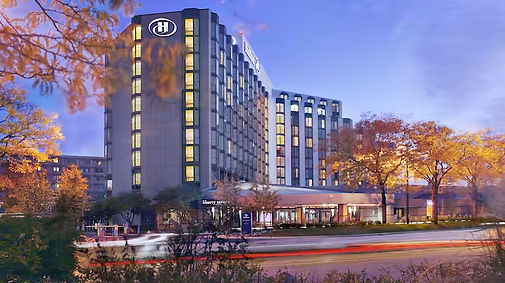 hilton-rosemont-hotel-exterior-night-fall.jpg
