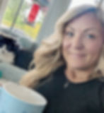 Co-Founder, FAITH+FEARLESS Beauty having tea with her cat in background