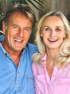 Gail and Steve - shot of a couple featuring a woman with shoulder-length curly hair, a wide smile, with a man with a wide smile, and swept hair, represented by ROC Talent Agency UK