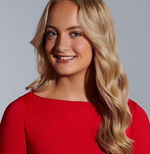 Lois -  headshot of youth model with long wavy blonde hair, clear skin and wearing a red top, represented by ROC Talent Agency UK