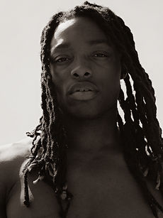 Sidney - headshot of male model with shoulder length twisted dreadlocks, a clean-shaven face, and defined jawline, represented by ROC Talent Agency UK