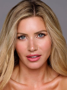 Helena - headshot of a female model with wavy light hair, a natural smile, represented by ROC Talent Agency UK