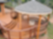 Custom gazebo and fire pit area in backyard deck