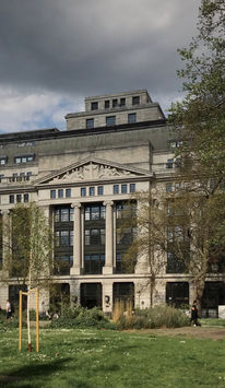 Victoria is a large office building, with an intricate, ornate facade facingthe green of Bloomsbury Square in the heart of London.