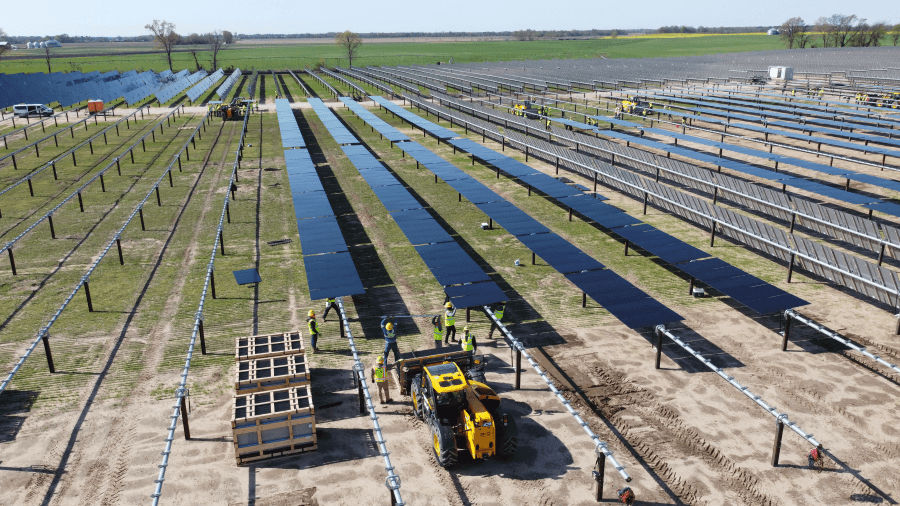 Heavy equipment performing civil grading and erosion repair at a utility-scale solar farm