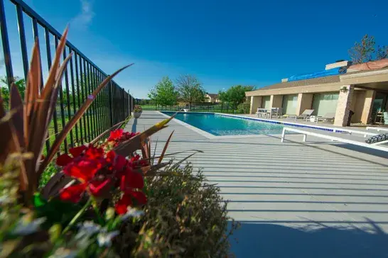 Custom inground pool adding value to an Oklahoma home built by Signature Custom Pools