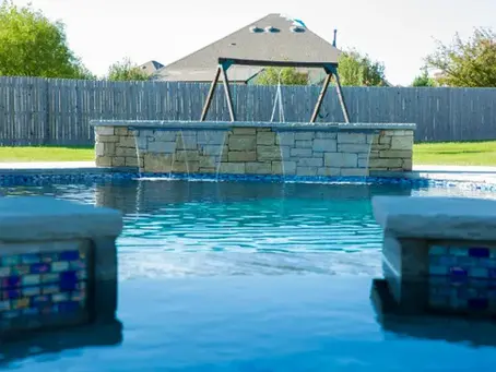 Custom inground pool with clear water built by Signature Custom Pools in Oklahoma
