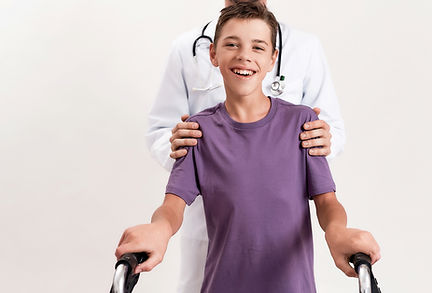 boy being held by doctor