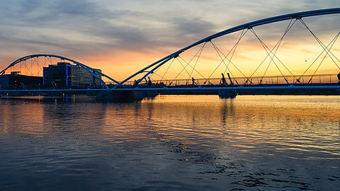 Sunset view of Tempe bridge with people walking