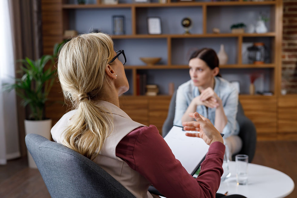 Therapist and patient in session, discussing concerns