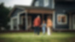 Grandparents walking with grandchild in front of a blue house.