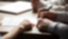 notary with a client signing documents