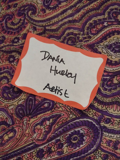 a name badge with my name and artist underneath