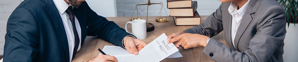 Man signing an insurance policy