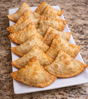 A golden fried pastry filled with either beef or chicken 